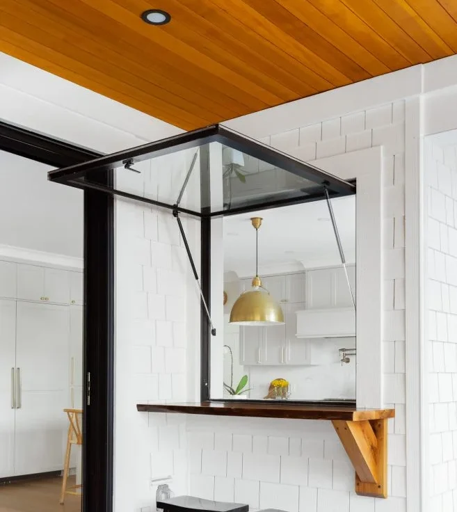 Contemporary outdoor serving window with hidden screen